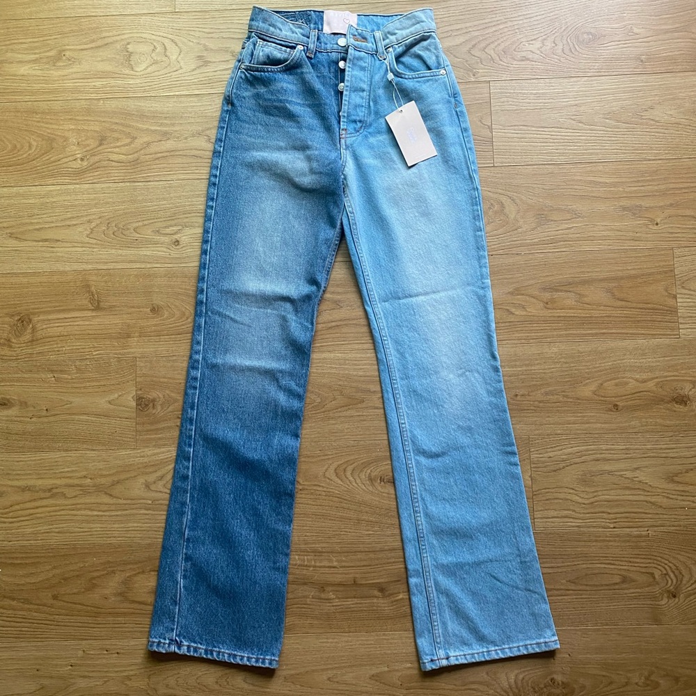 Size 26 (runs small). Never worn. Tags on. Bought for $65